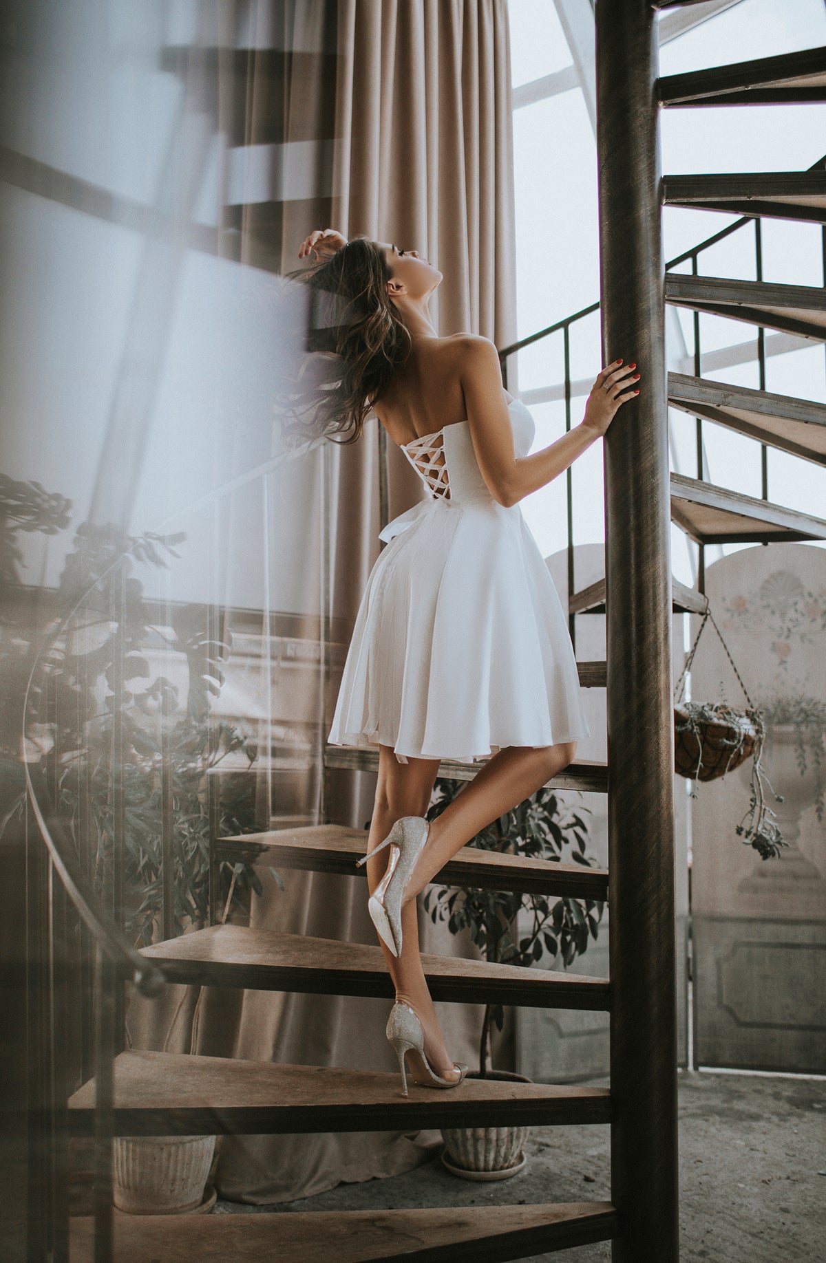 Handmade ivory wedding dress with off-shoulder design and lace-up back